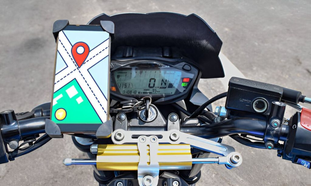 Smartphone mounted on Royal Enfield handlebar displaying navigation map, illustrating how to install and use the iTracker GPS tracking device on a motorcycle.